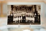 Children assembled in the hall with the nuns and Fr. Zarsky, early 1940s. / Photo: Beaton Institute Collections / CKP_3941