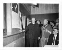 Photograph of the unveiling of a plaque during Father Zarsky's during his silver jubilee for the ordination of Father Zarsky.
